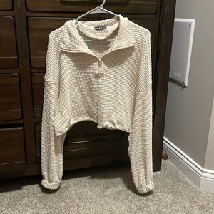 Small, cropped zip up